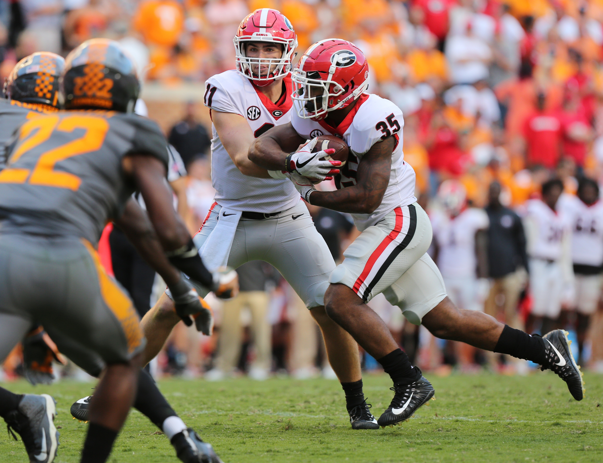 University of Georgia quarterback Jake Fromm (11) hands the ball off to Brian Herrien (35) during the University of Tennessee vs. University of Georgia football game at Neyland Stadium in Knoxville, Tenn., Saturday, Sept. 30, 2017.