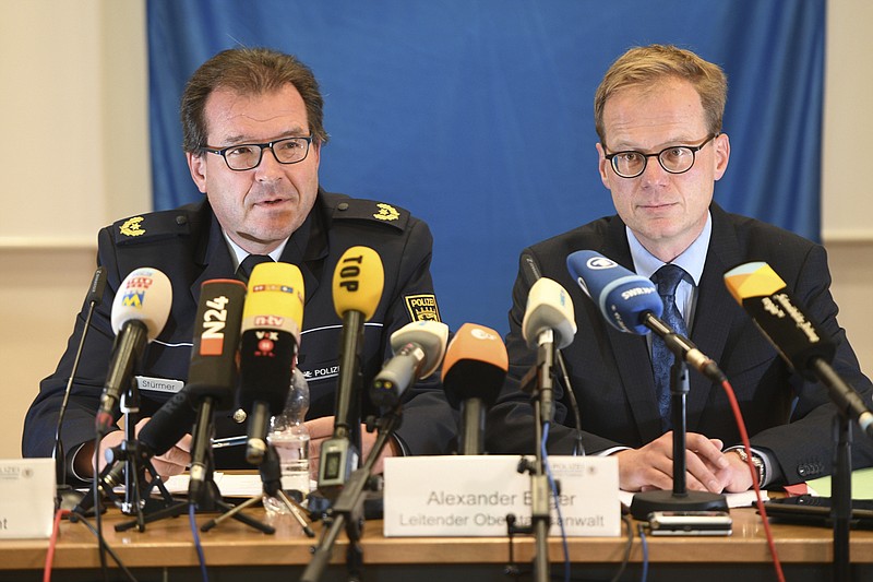 
              Uwe Stuermer from the Konstanz police department, left,  and prosecutor  Alexander Boger speak during a press conference in Konstanz, Germany, Saturday, Sept. 30, 2017. German authorities have arrested a  man suspected of making threats to poison supermarket food unless a large payment was made. Police and prosecutors in the state of Baden-Wuerttemberg said the man arrested Friday is "urgently suspected" of attempted blackmail. (Felix Kaestle/dpa via AP)
            