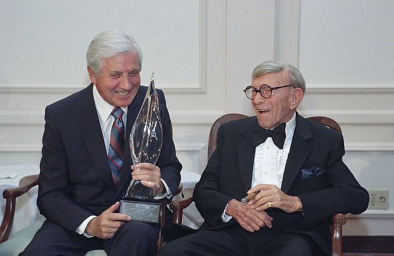 
              FILE - In this March 14, 1993, file photo, Monty Hall, left, recipient of the 2nd Annual George Burns Lifetime Award, laughs with George Burns at the United Jewish Fund tribute to humanitarian Hall, in the Century City section of Los Angeles. Former "Let's Make a Deal" host Hall has died after a long illness at age 96. His daughter Sharon Hall says he died Saturday, Sept. 30, 2017, at his home in Beverly Hills, Calif.  (AP Photo/Julie Markes, File)
            