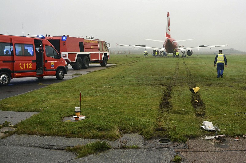 
              In this picture released by the fire brigade Westerland ( Freiwillige Feuerwehr Westerland), an Airbus of Air Berlin stands in a meadow near Westerland on the German North Sea island of Sylt, Saturday, Sept. 30, 2017. German authorities say the plane overshot the end of the runway  but nobody was injured in the incident. The regional emergency response center says the Air Berlin plane from Duesseldorf came to halt on grass about 50 meters beyond the end of the runway Saturday.  ( Joerg Elias/Freiwillige Feuerwehr Westerland/dpa  via AP)
            