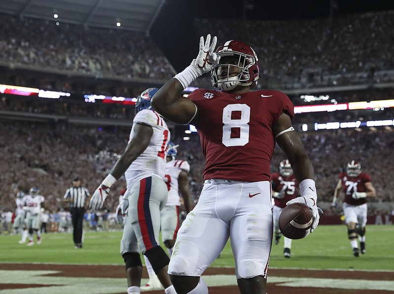 Alabama running back Josh Jacobs celebrates an 18-yard touchdown reception from Jalen Hurts that put the Crimson Tide up 28-3 early in the second quarter Saturday night against Ole Miss in Tuscaloosa.