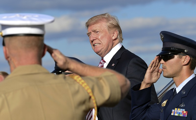 President Donald Trump walks down the steps of Air Force One at Morristown Municipal Airport in Morristown, N.J., Friday, Sept. 29, 2017. Trump is spending the weekend in Bedminster, N.J., at his golf club. (AP Photo/Susan Walsh)