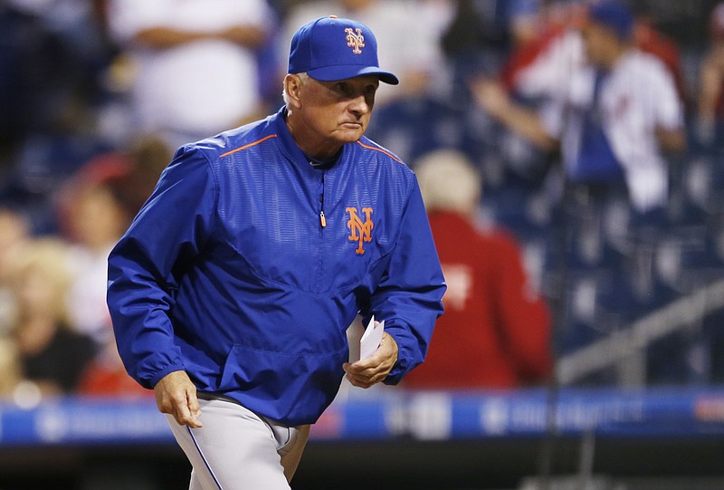 
              New York Mets manager Terry Collins runs to the dugout before the start of a baseball game against the Philadelphia Phillies, Friday, Sept. 29, 2017, in Philadelphia. (AP Photo/Laurence Kesterson)
            