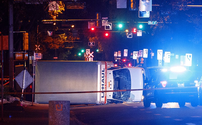 
              A U-Haul truck rests on its side after a high-speed chase with police in Edmonton Alta, on Saturday Sept. 30, 2017.  Police say the U-Haul intentionally swerved at pedestrians at crosswalks throughout the chase. (Jason Franson/The Canadian Press via AP)
            