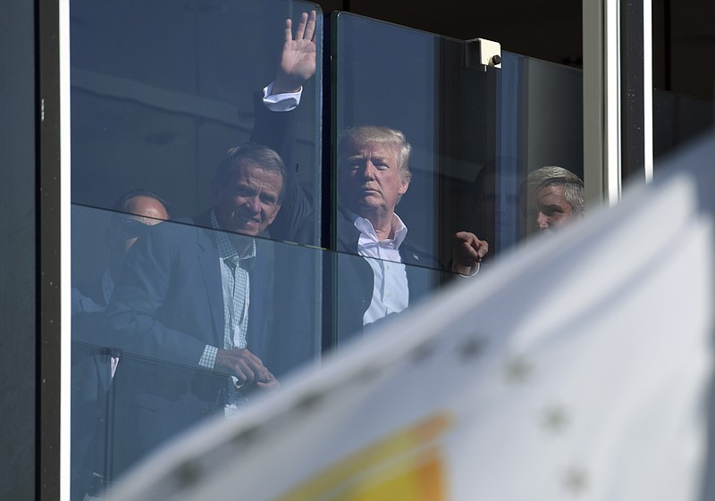 
              President Donald Trump watches the Presidents Cup golf tournament in Jersey City, N.J., Sunday, Oct. 1, 2017. The President of the United States is the Honorary Presidents Cup Chairman. (AP Photo/Susan Walsh)
            