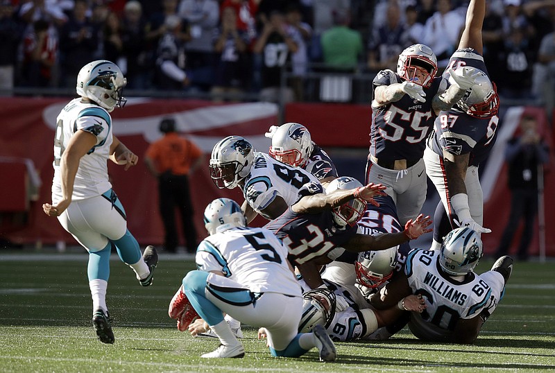 
              Carolina Panthers kicker Graham Gano, left, kicks the game-winning field goal as Michael Palardy (5) holds at the end of an NFL football game against the New England Patriots, Sunday, Oct. 1, 2017, in Foxborough, Mass. The Panthers won 33-30. (AP Photo/Charles Krupa)
            