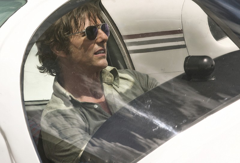 
              This image released by Universal Pictures shows Tom Cruise as Barry Seal in a scene from, "American Made." (David James/Universal Pictures via AP)
            