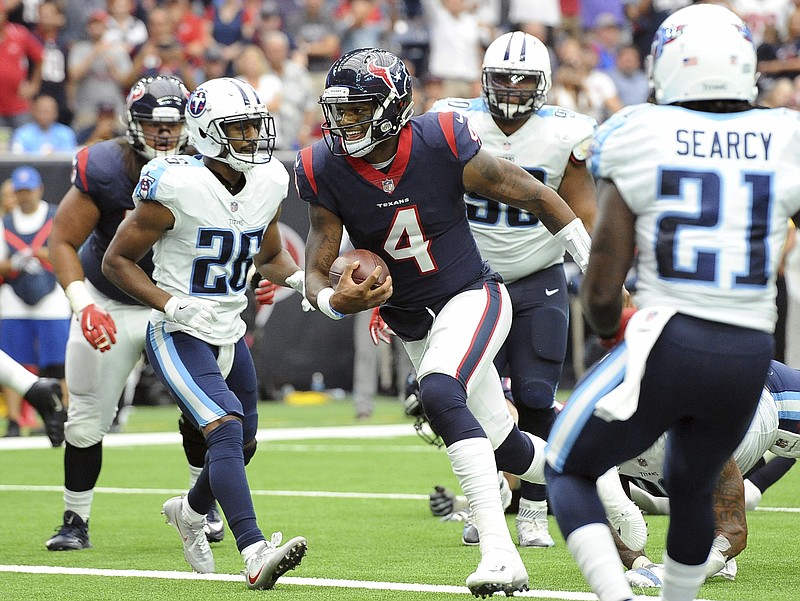 
              Houston Texans quarterback Deshaun Watson (4) runs for a touchdown against the Tennessee Titans during the first half of an NFL football game, Sunday, Oct. 1, 2017, in Houston. (AP Photo/George Bridges)
            