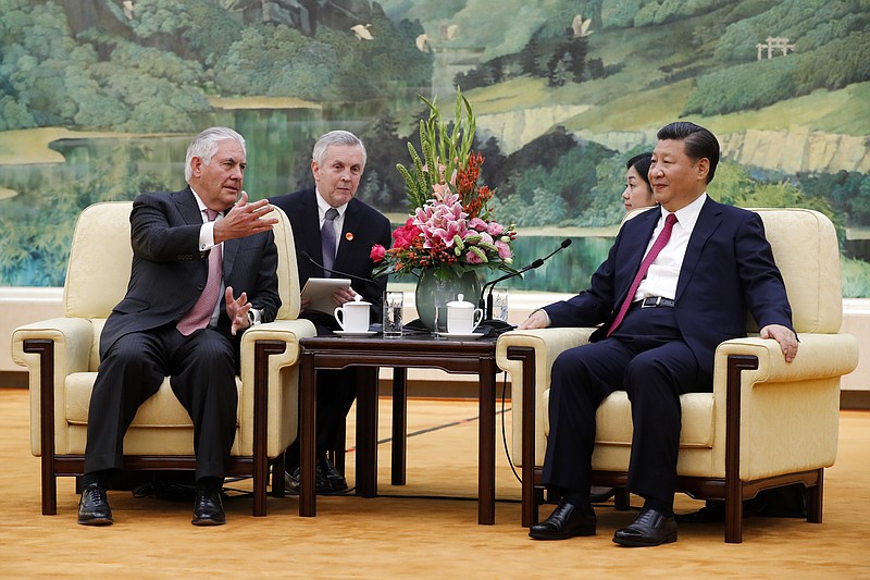 
              U.S. Secretary of State Rex Tillerson, left, chats with China's President Xi Jinping during a meeting at the Great Hall of the People in Beijing, Saturday, Sept. 30, 2017. (AP Photo/Andy Wong, Pool)
            