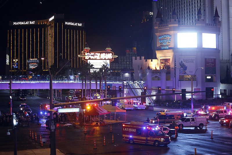 
              Las Vegas Metro Police and medical workers block off an intersection after a mass shooting at a music festival on the Las Vegas Strip on Sunday, Oct. 1, 2017. (Steve Marcus/Las Vegas Sun via AP)
            