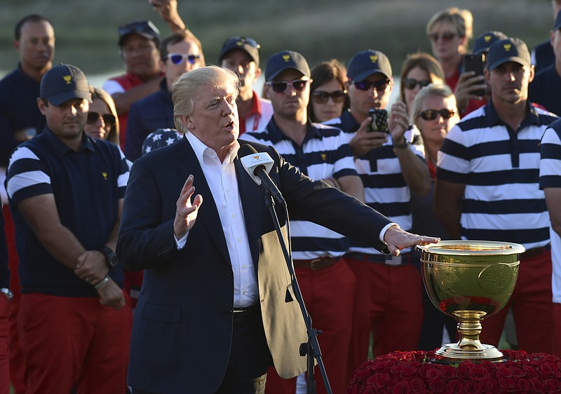 
              President Donald Trump speaks before presenting the winner's trophy to the U.S. Team after the final round of the Presidents Cup at Liberty National Golf Club in Jersey City, N.J., Sunday, Oct. 1, 2017. (AP Photo/Susan Walsh)
            