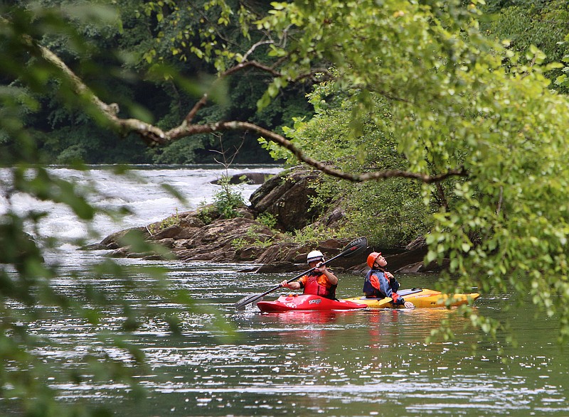 A couple of kayakers prepare to take on a rapid on June 30, 2017, on the Ocoee River in Polk County, Tenn. TVA adjusts water levels throughout the year to ensure the river is fully utilized and protected.