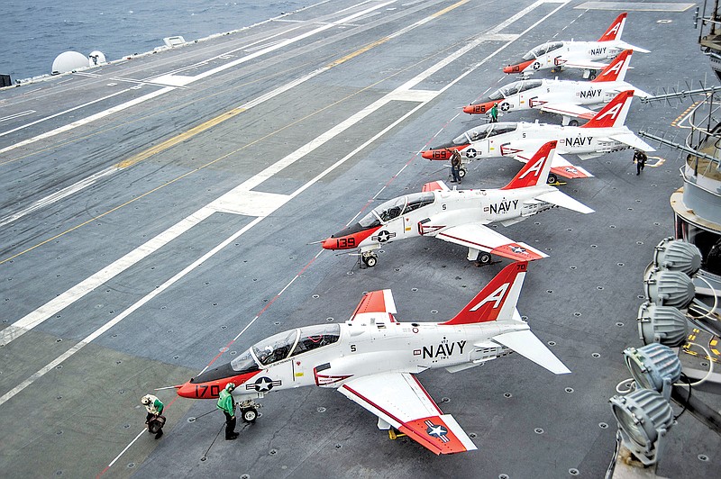 T-45C Goshawks from Training Air Wing One wait on the flight deck of the aircraft carrier USS George Washington docked in Norfolk, Va., in 2016. (Associated Press file photo by Petty Officer 2nd Class Bryan Mai/U.S. Navy)