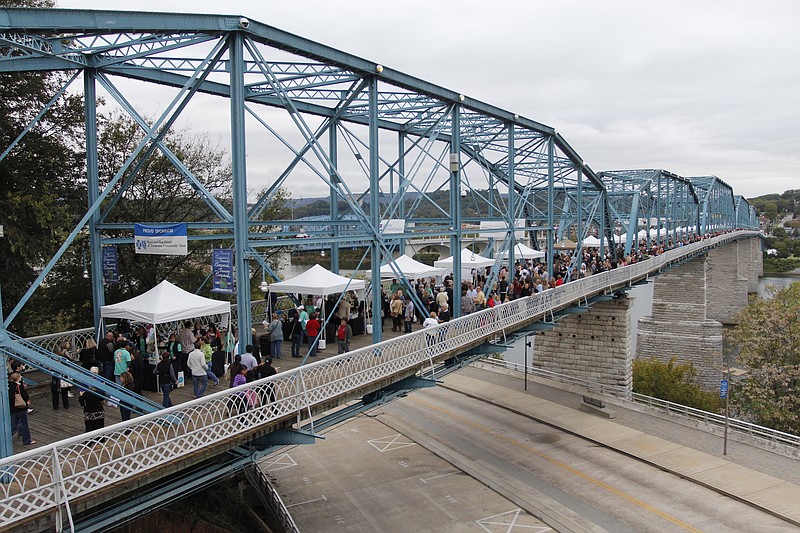 People pack the Walnut Street Bridge for every Wine Over Water.