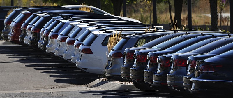In this Thursday, Sept. 24, 2015, photo, Volkswagen cars for sale are on display on the lot of a dealership in Boulder, Colo. General Motors and Ford each posted strong U.S. sales in September 2017, confirming predictions that the industry could rebound for the month. (AP Photo/Brennan Linsley)