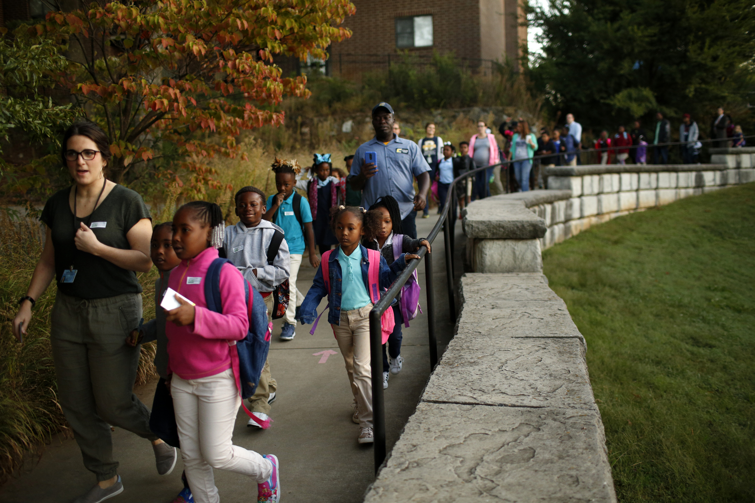 Brown Elementary students walk on the University Greenway from the University of Tennessee at Chattanooga's Challenger Center to school on East Eighth Street for International Walk to School Day on Tuesday, October 3, 2017, in Chattanooga, Tenn. Ten area schools have organized walk to school events this week in partnership with the Chattanooga-Hamilton County and North Georgia Transportation Planning Organizations.