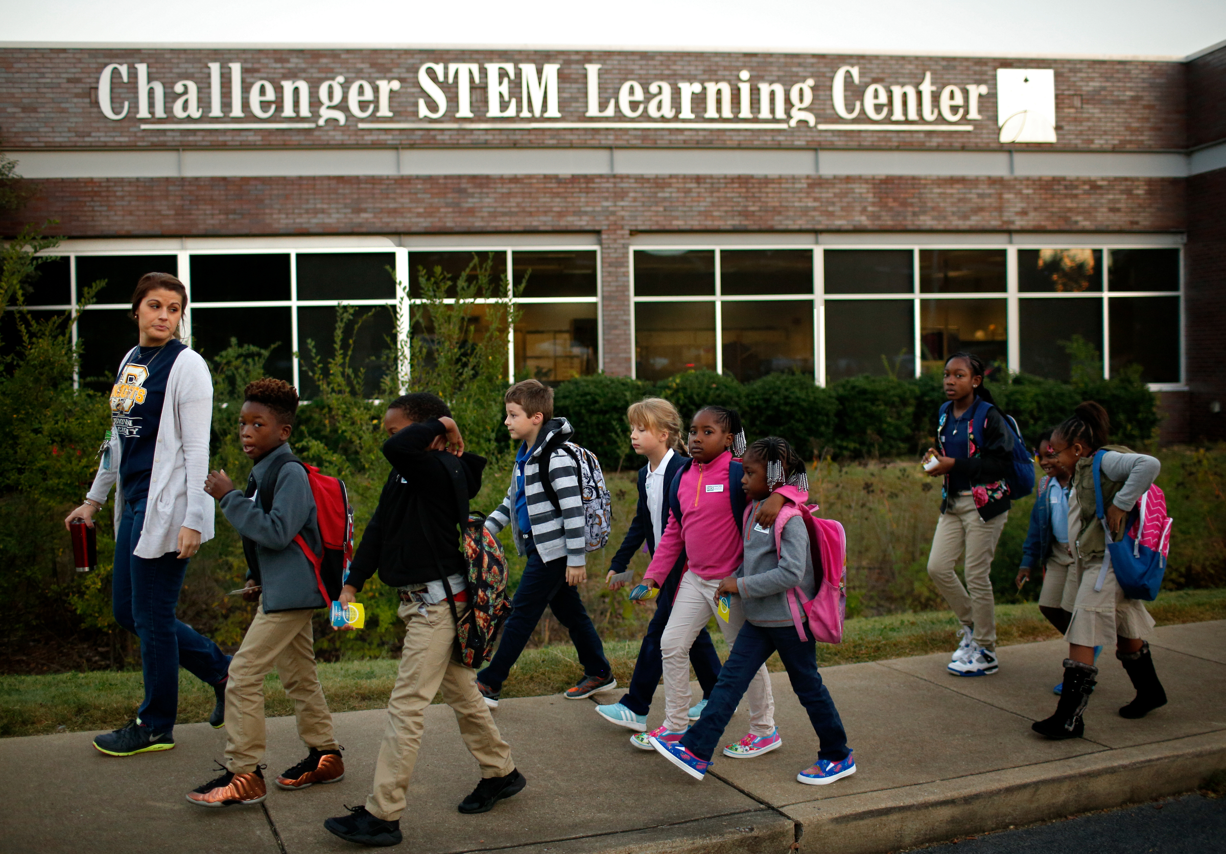 Brown Elementary students walk from the University of Tennessee at Chattanooga's Challenger Center to school on East Eighth Street for International Walk to School Day on Tuesday, October 3, 2017, in Chattanooga, Tenn. Ten area schools have organized walk to school events this week in partnership with the Chattanooga-Hamilton County and North Georgia Transportation Planning Organizations.