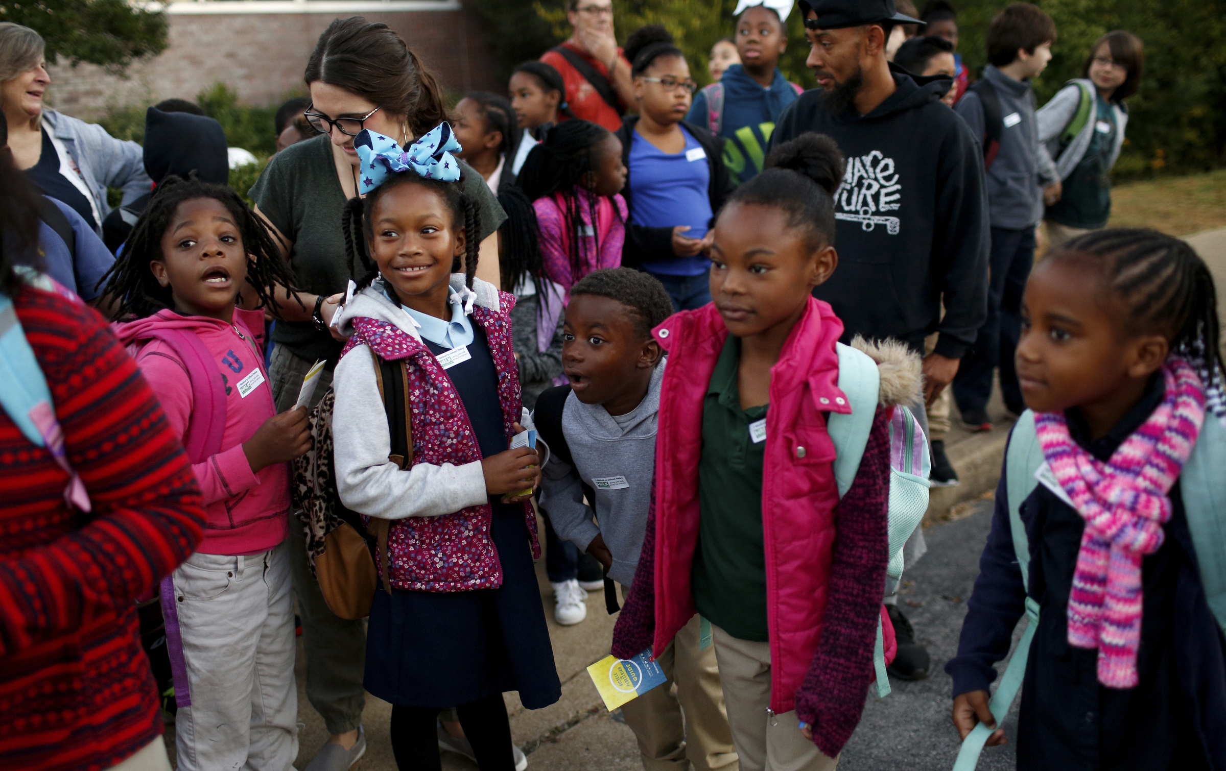 Brown Elementary students wait to walk from the University of Tennessee at Chattanooga's Challenger Center to school on East Eighth Street for International Walk to School Day on Tuesday, October. 3, 2017, in Chattanooga, Tenn. Ten area schools have organized walk to school events this week in partnership with the Chattanooga-Hamilton County and North Georgia Transportation Planning Organizations.