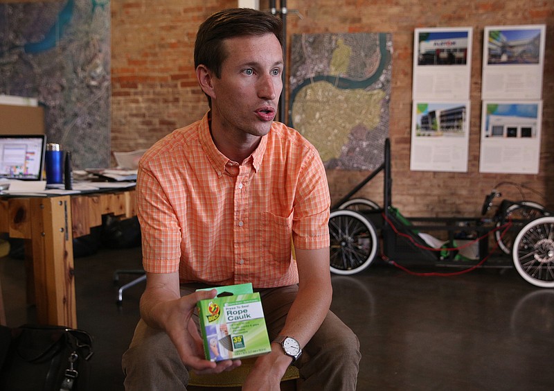 Michael Walton, GreenSpaces executive director, talks about different items in a kit he and others put together for Empower Chattanooga Tuesday, Oct. 3, 2017, at GreenSpaces in downtown Chattanooga, Tenn. Empower Chattanooga teaches residents of East Chattanooga, Highland Park, East Lake, and Alton Park low cost ways to reduce their utility bill.