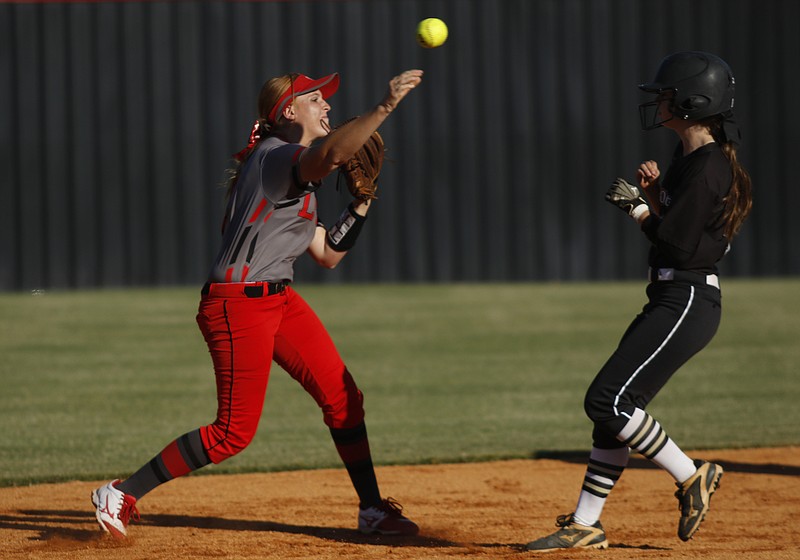 Lakeview-Fort Oglethorpe shortstop Taylor Phillips throws to first base to try for the double play after forcing out Calhoun's M.J. Mashburn at second during Wednesday's Region 6-3A championship series in Fort Oglethorpe. Calhoun swept the doubleheader 6-5 and 11-2.