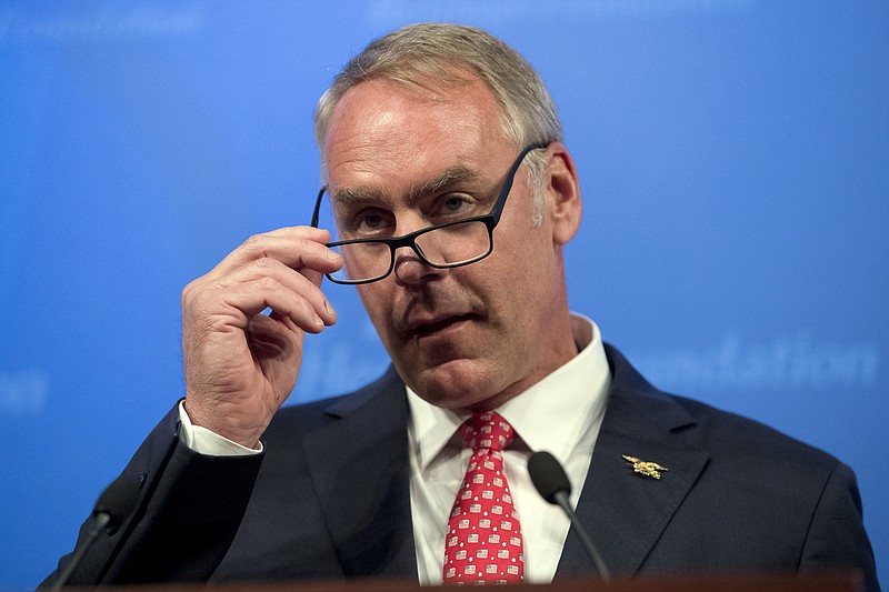 
              In this Sept. 29, 2017, photo, Interior Secretary Ryan Zinke speaks on the Trump Administration's energy policy at the Heritage Foundation in Washington. The Interior Department inspector general has opened an investigation into Zinke's use of private air charters. (AP Photo/Andrew Harnik)
            