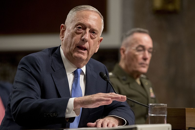 
              Defense Secretary Jim Mattis, left, accompanied by Joint Chiefs Chairman Gen. Joseph Dunford, speaks on Afghanistan before the Senate Armed Services Committee on Capitol Hill in Washington, Tuesday, Oct. 3, 2017. (AP Photo/Andrew Harnik)
            