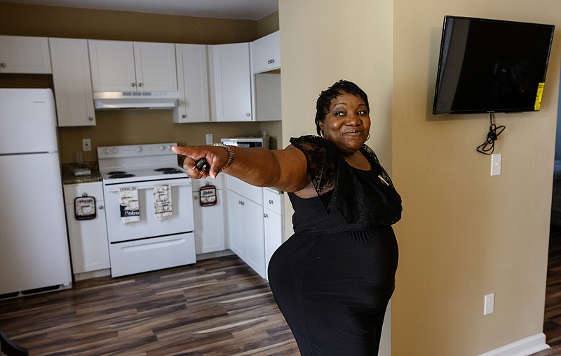 Sharon Kelly gives a tour of a new senior home following the opening of new senior housing at Rose of Sharon Senior Villas on Thursday, Sept. 14, 2017, in Chattanooga, Tenn. The new two-person homes will cost seniors $444 each per month with utilities included.