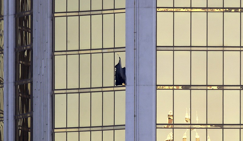 A broken window at the Mandalay Bay Resort and Casino on the Las Vegas Strip is likely from the room where a shooter carried out the largest mass murder in recent U.S. history on Oct. 1.