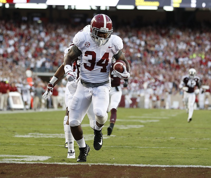 Crimson Tide junior running back Damien Harris finishes a 75-yard touchdown run during the first quarter of Saturday night's 27-19 win at Texas A&M.