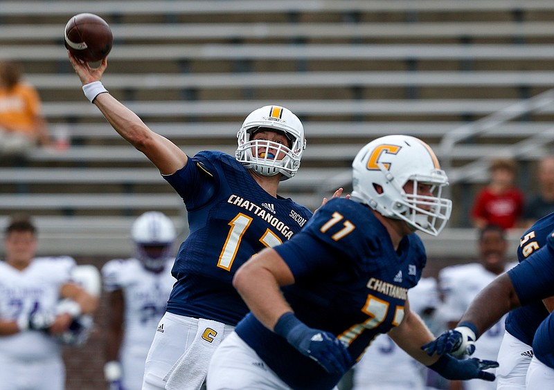 UTC quarterback Cole Copeland (12) passes with protection from UTC offensive lineman Taylor Helton (77) during the Mocs' home football game against the Furman Paladins at Finley Stadium on Saturday, Oct. 7, 2017, in Chattanooga, Tenn.