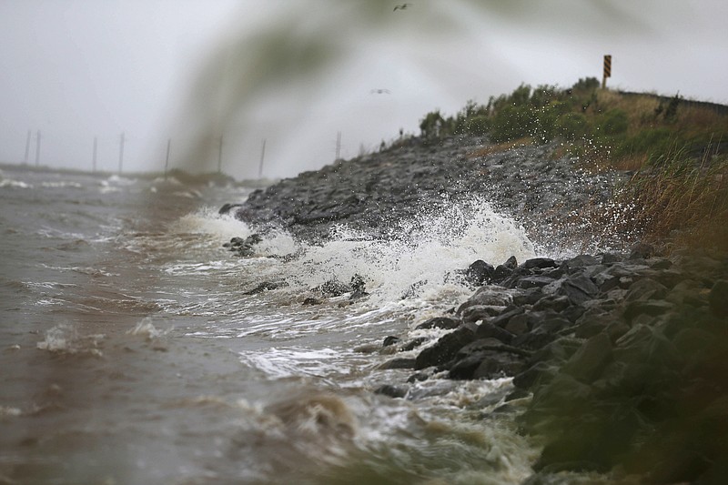 
              Gulf Coast waves crash against rocks as winds continue to speed up in Coden, Ala., on Saturday, Oct. 7, 2017, ahead of Hurricane Nate, expected to make landfall on the Gulf Coast later in the day. (AP Photo/Brynn Anderson)
            