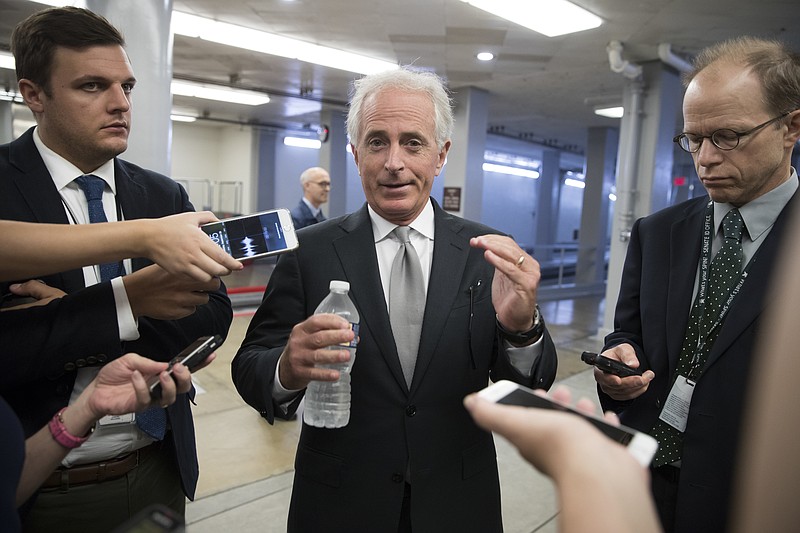 
              FILE - In this Sept. 26, 2017, file photo, Sen. Bob Corker, R-Tenn., chairman of the Senate Foreign Relations Committee, chats with reporters at the Capitol in Washington. Always one to speak his mind, Corker’s new free agent status should make President Donald Trump and the GOP very nervous. The two-term Tennessee Republican isn’t seeking re-election. And that gives him even more elbow room to say what he wants and vote how he pleases over the next 15 months as Trump and the party’s top leaders on Capitol Hill struggle to get their agenda on track. (AP Photo/J. Scott Applewhite, File)
            