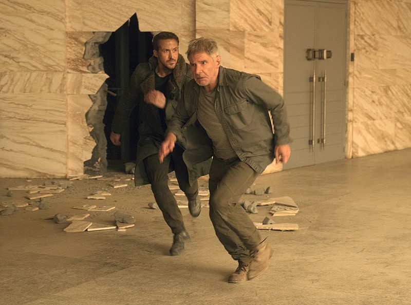 
              This image released by Warner Bros. Pictures shows Ryan Gosling, left, and Harrison Ford in a scene from "Blade Runner 2049." (Stephen Vaughan/Warner Bros. Pictures via AP)
            