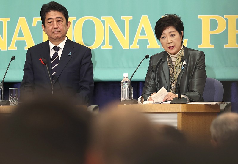 
              Party of Hope leader Yuriko Koike, right, speaks as Ruling Liberal Democratic Party leader and Japan's Prime Minister Shinzo Abe listens during the party leaders' debate for the Oct. 22 lower house election in Tokyo, Sunday, Oct. 8, 2017. Just days before Japan’s national election campaign kicks off on Oct. 10, 2017, all eyes are on Koike, Tokyo’s populist governor, a political go-getter and a gambler. Will she jump into the race and try to unseat Prime Minister Abe?  (AP Photo/Koji Sasahara)
            