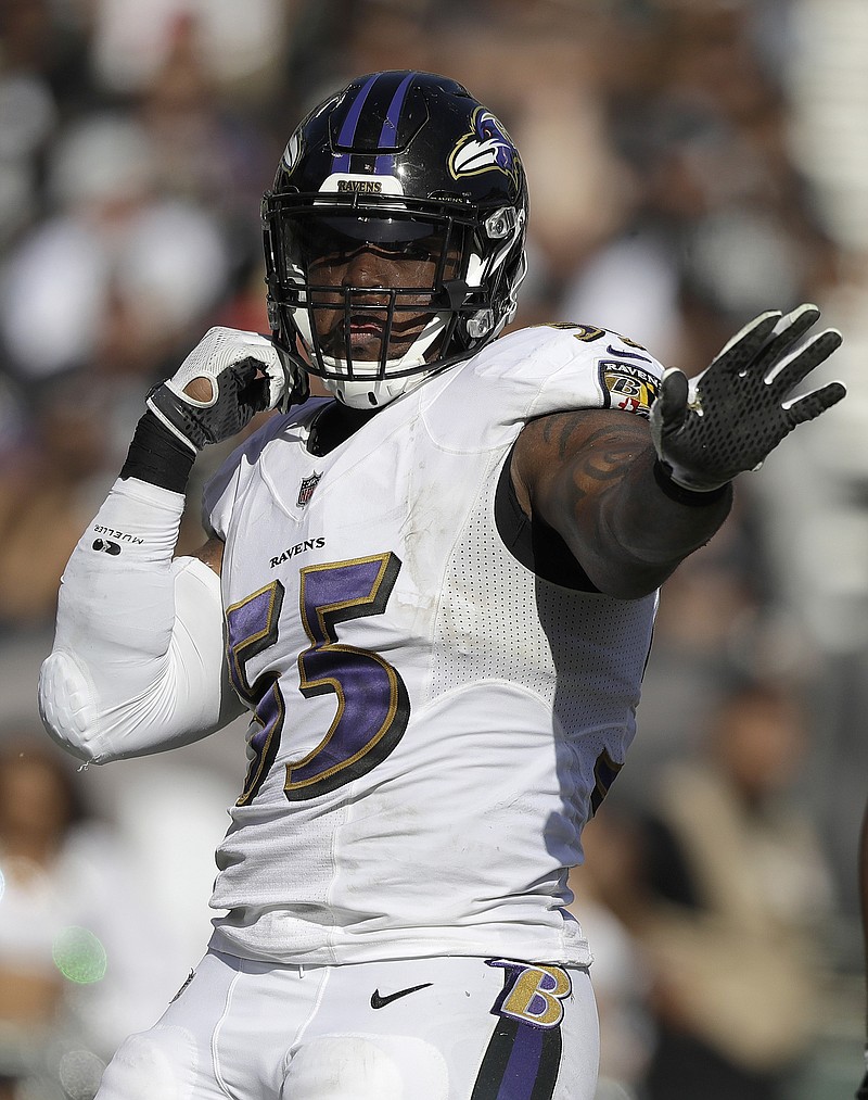 
              Baltimore Ravens outside linebacker Terrell Suggs (55) celebrates after sacking Oakland Raiders quarterback EJ Manuel during the second half of an NFL football game in Oakland, Calif., Sunday, Oct. 8, 2017. (AP Photo/Marcio Jose Sanchez)
            