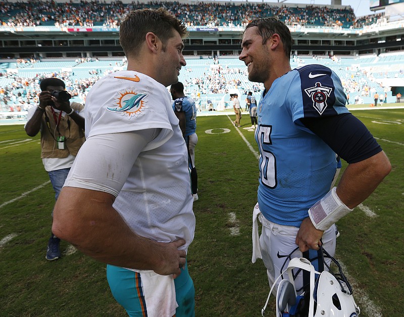 Miami Dolphins quarterback Jay Cutler (6) and Tennessee Titans quarterback Matt Cassel (16), talks at the end of an NFL football game, Sunday, Oct. 8, 2017, in Miami Gardens, Fla. The Dolphins defeated the Titans 16-10. (AP Photo/Wilfredo Lee)