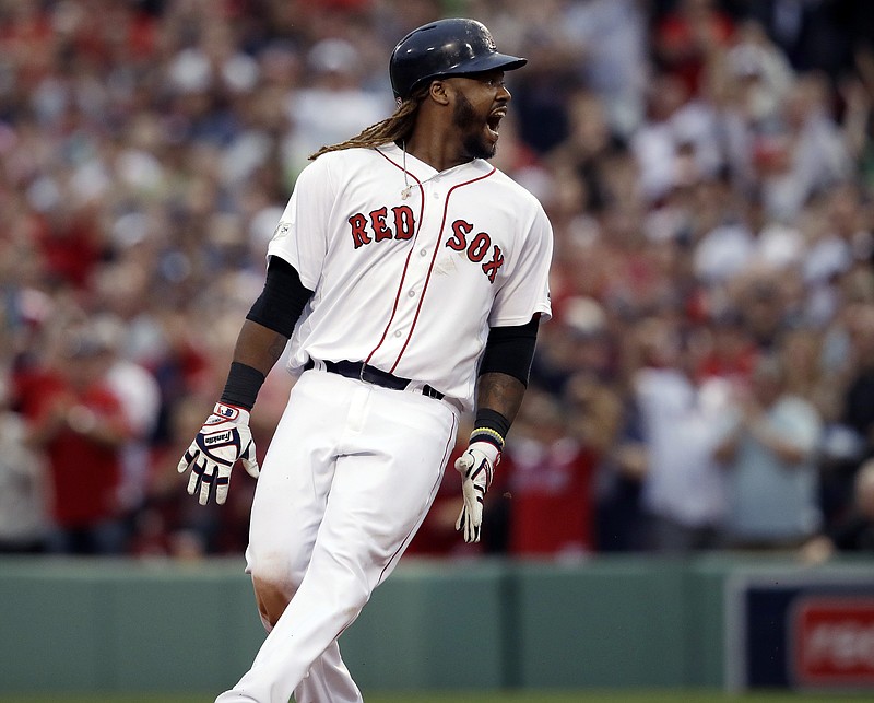 
              Boston Red Sox designated hitter Hanley Ramirez shouts after hitting a two-run RBI double during the seventh inning in Game 3 of baseball's American League Division Series against the Houston Astros, Sunday, Oct. 8, 2017, in Boston. (AP Photo/Charles Krupa)
            