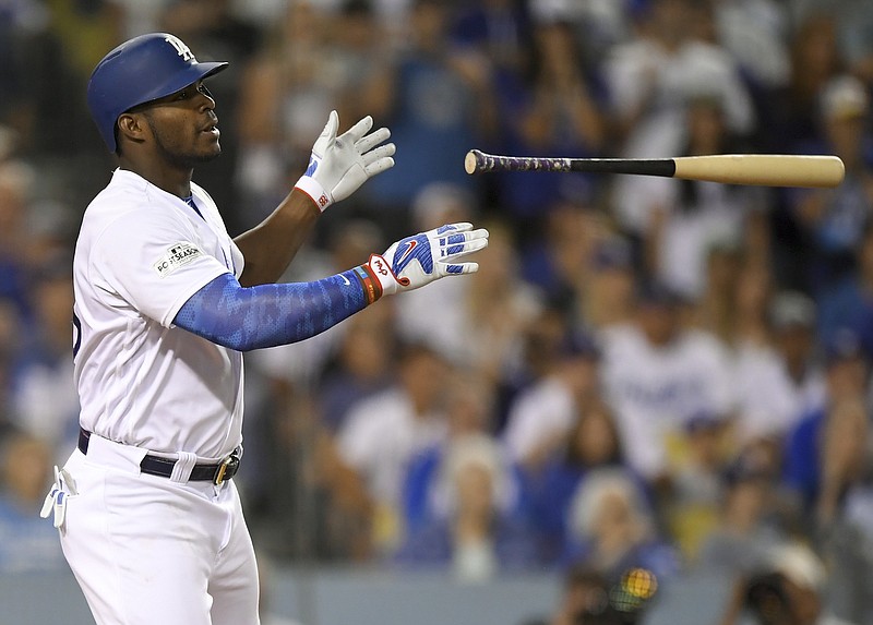 
              Los Angeles Dodgers' Yasiel Puig celebrates after a single against the Arizona Diamondbacks during the fourth inning of Game 2 of baseball's National League Division Series in Los Angeles, Saturday, Oct. 7, 2017. (AP Photo/Mark J. Terrill)
            