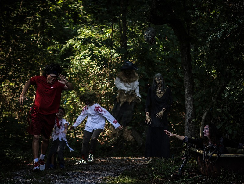 Participants in the 5k Zombie Trail Run attempt to finish the race without becoming "infected," which happens when a "zombie" steals their flag. (Contributed photo by Drew Eldridge)