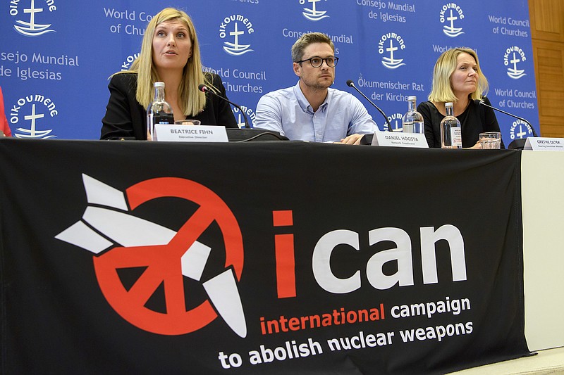 Beatrice Fihn, left, executive director of the International campaign to abolish Nuclear Weapons, ICAN, Daniel Hogsta, center, coordinator of the international campaign to abolish Nuclear Weapons, ICAN, and Grethe Ostern, right, member of the steering committee, speaks during a news conference, at ICAN headquarters in Geneva, Switzerland, last Friday. ICAN is the winner of this year's Nobel Peace Prize.