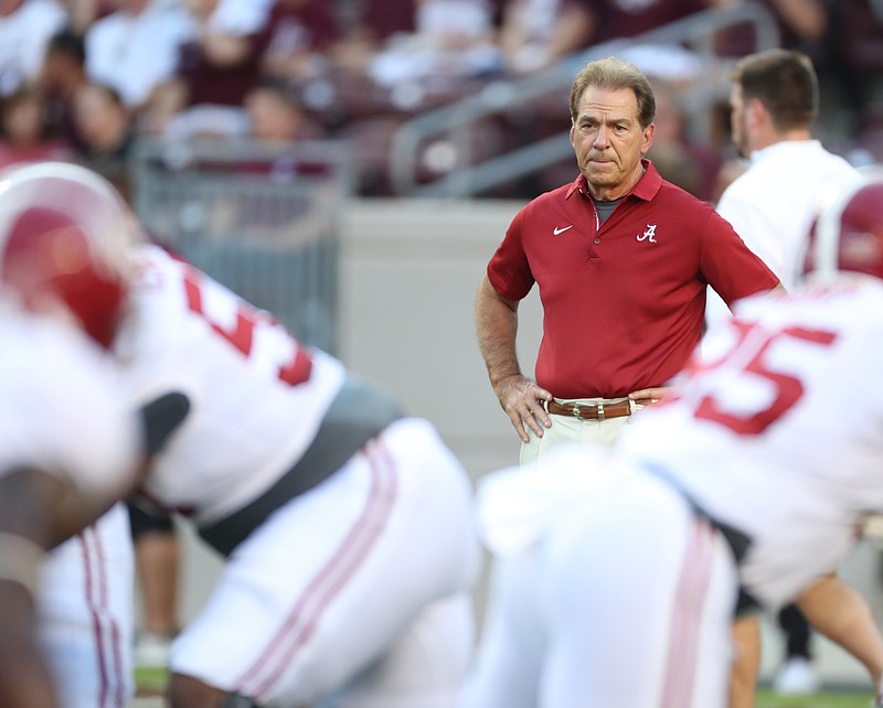 Alabama football coach Nick Saban watches his players go through warmups before Saturday night's game at Texas A&M. Saban said Monday that his Crimson Tide played an "ordinary game" against the Aggies.