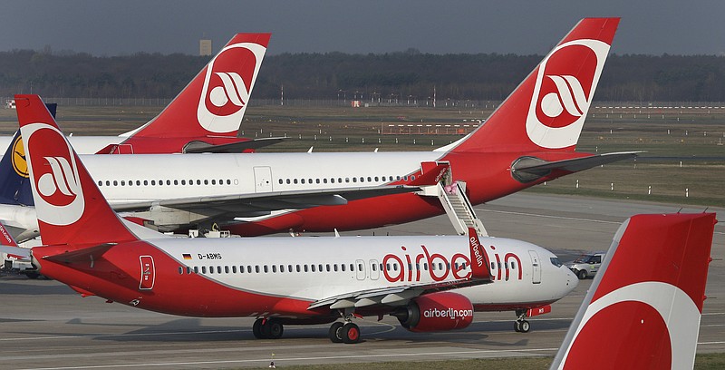 
              FILE - In this April 2, 2014 file photo airplanes of the German airline 'Air Berlin' are pictured at the Tegel airport in Berlin, Germany. Bankrupt German airline Air Berlin said Monday, Oct. 9, 2017  it’s preparing to end flights at the end of October.  (AP Photo/Michael Sohn, file)
            