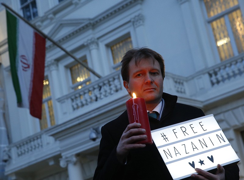 
              FILE -- In this Jan. 16, 2017 file photo, Richard Ratcliffe, husband of imprisoned charity worker Nazanin Zaghari-Ratcliffe, poses for the media during an Amnesty International led vigil outside the Iranian Embassy in London. Ratcliffe said his wife now faces new charges and the possibility of her sentence being extended by 16 years. Ratcliffe said in a statement that his wife appeared in court on Sunday, Oct. 8, 2017, at Tehran's Evin prison and that the new charges would prevent her from seeking early release next month as allowed by Iranian law. (AP Photo/Alastair Grant, File)
            