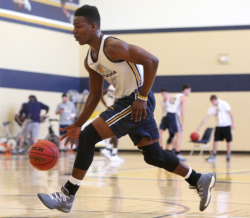 University of Tennessee at Chattanooga basketball player Jonathan Bryant (33) works on drills during practice at Chattem Gym at UTC on Monday, Oct. 9, 2017, in Chattanooga, Tenn.