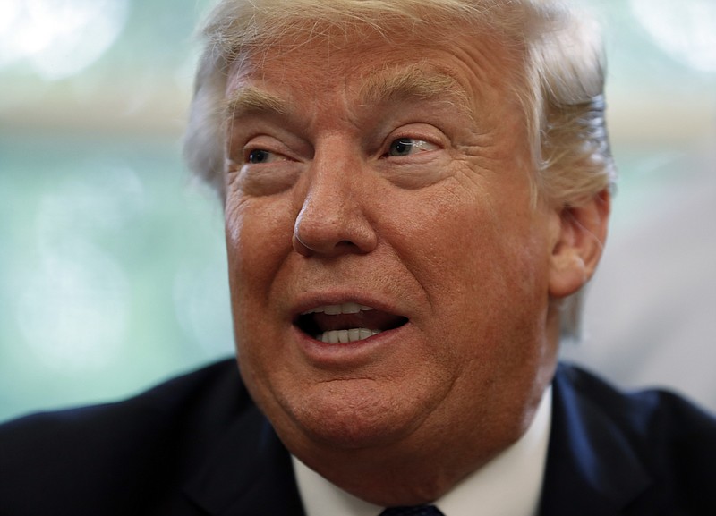 President Donald Trump speaks in the Oval Office of the White House in Washington on Friday.