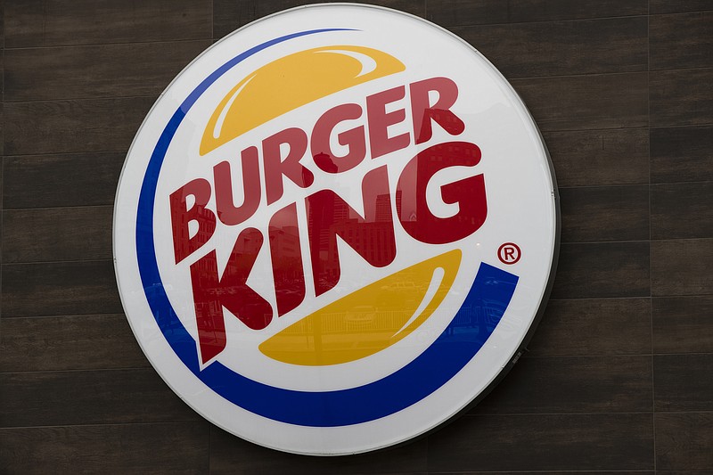 This Friday, Oct. 21, 2016, photo shows a Burger King restaurant logo in Philadelphia. Burger King is adding spicy nuggets to its menu and firing up a rivalry with burger chain Wendy’s, which pulled the peppery snack from most of its restaurants earlier in 2017. (AP Photo/Matt Rourke)