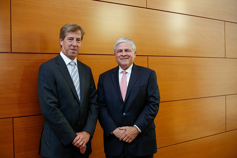 CEO Rick Davis, left, and Chattanooga office managing shareholder Nick Decosimo pose for a photo before a reception for Elliott Davis Decosimo at the Hunter Museum of American Art on Wednesday, Oct. 11, 2017, in Chattanooga, Tenn. The accounting and consulting firm is dropping the Decosimo name from its title as it expands into new markets.