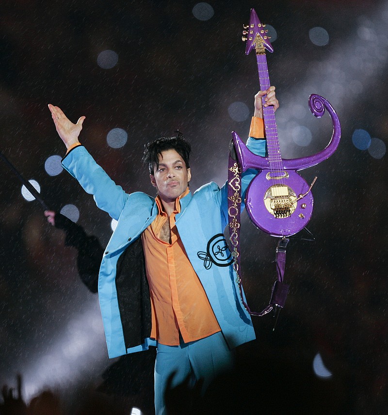 
              FILE - In this Feb. 4, 2007 file photo, Prince performs during halftime of the Super Bowl XLI football game in Miami. Two sisters and heirs of the late rock superstar Prince said Wednesday, Oct. 11, 2017, they're angered that the contents of his vault, including master tapes of unreleased music, have been removed from his Paisley Park studio complex and shipped to California. (AP Photo/Chris O'Meara, File)
            