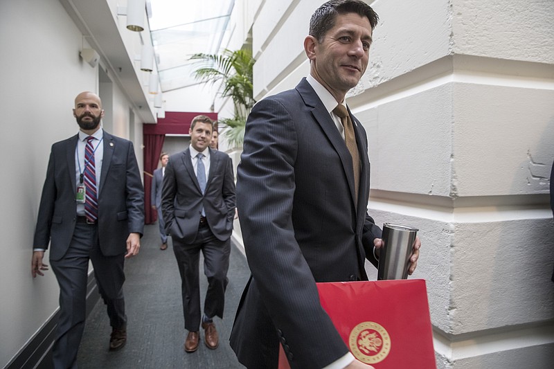 
              Speaker of the House Paul Ryan, R-Wis., walks to a meeting with House Republicans at the Capitol in Washington, Wednesday, Oct. 11, 2017.  (AP Photo/J. Scott Applewhite)
            