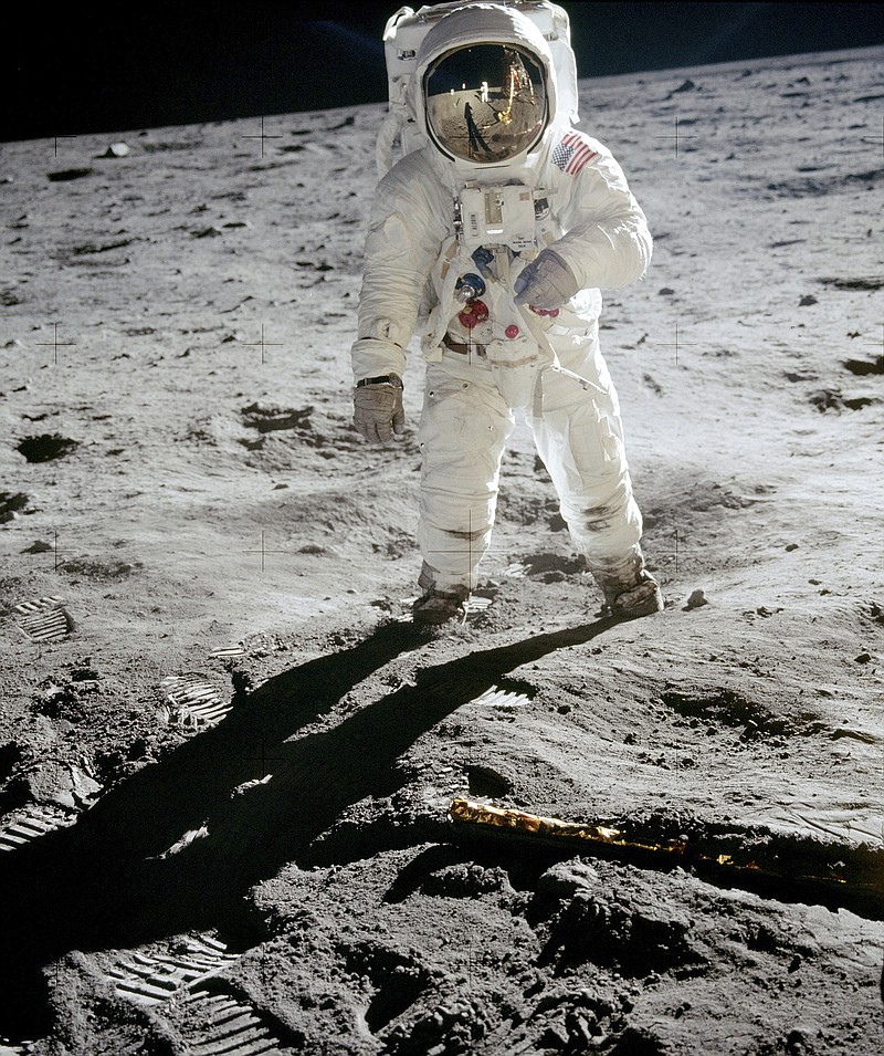 
              In this 1969 photo released by NASA, astronaut Buzz Aldrin walks on the surface of the moon near the leg of the lunar module Eagle during the Apollo 11 mission. Astronaut Neil Armstrong, who took the photograph, is reflected in Aldrin's visor. From Thursday, Oct. 12, 2017 through Nov. 2., Skinner Auctioneers and Appraisers is selling more than 400 vintage prints of photos, including the photo of Aldrin, made by American astronauts from 1961 to 1972. (Neil Armstrong/NASA via AP)
            